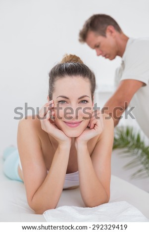 Happy patient looking at camera in medical office