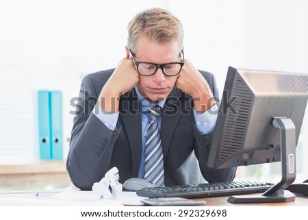 Businessman being depressed by accounting in his office