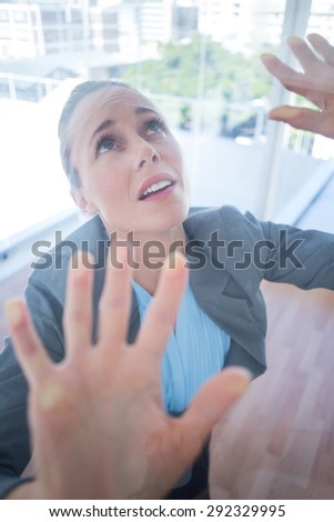Businesswoman feeling trapped in an office