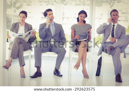 Business people sitting and waiting in the office