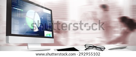 Computer screen against business interface with graphs and data