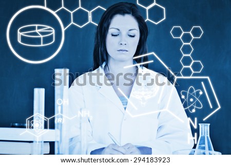 Science graphic against serious scientist taking notes