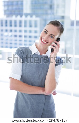 Smiling businesswomen talking on the phone at the patio