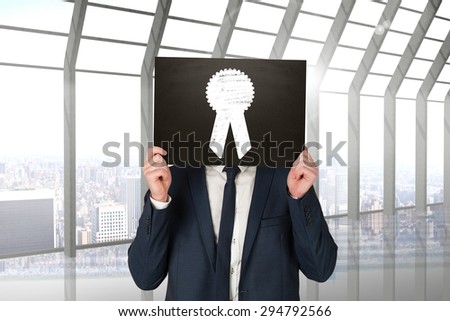 Businessman holding board against room with large window looking on city