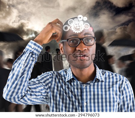 Young businessman thinking scratching head against blue sky