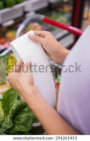 Close up view of woman reading her shopping list