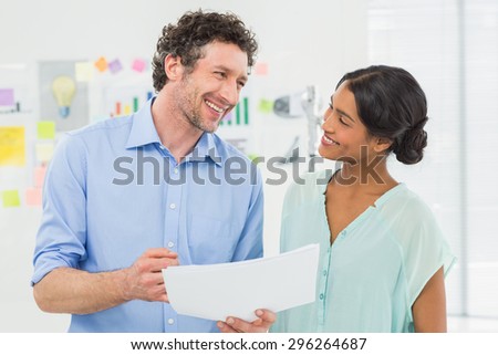 Two creative business people laughing together