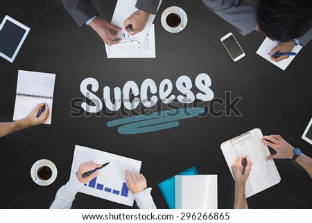 The word success and business meeting against blackboard
