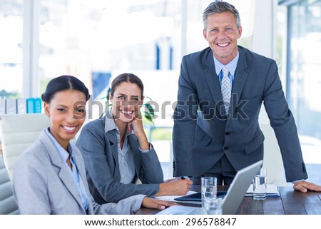 Business people looking at camera in office