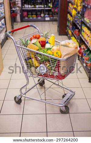 A trolley with healthy food at supermarket