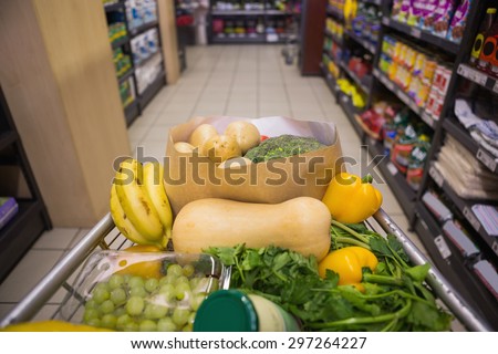 A trolley with healthy food at supermarket