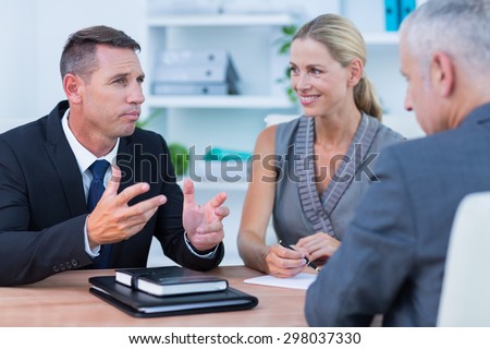 Business people speaking at meeting in the office