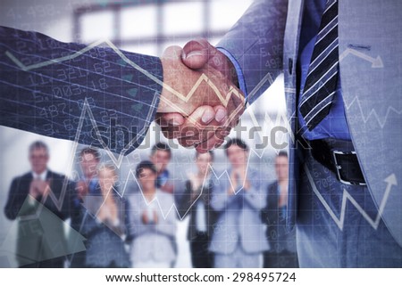 Businessman shaking hands with a co worker against stocks and shares
