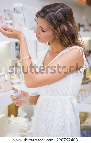 Woman testing perfume at a beauty salon
