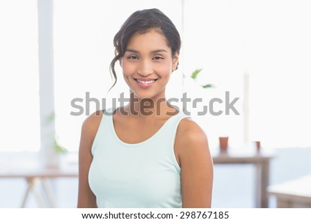 Smiling businesswoman at work in the office