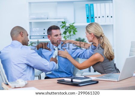 Business partners fighting together in the office