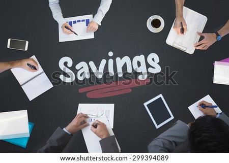 The word savings and business meeting against blackboard