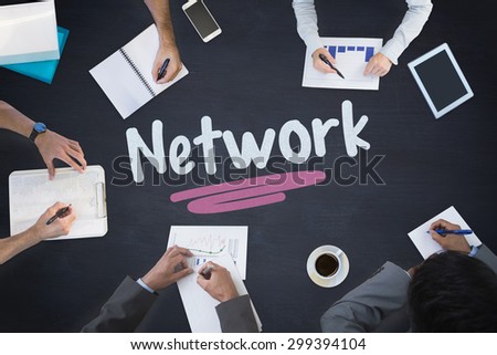 The word network and business meeting against blackboard