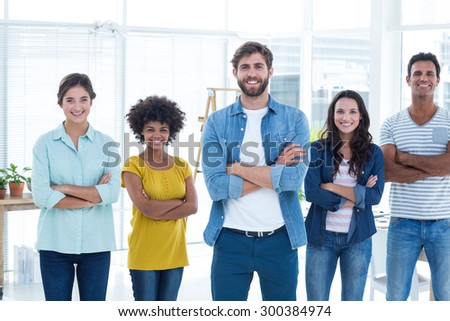Group portrait of happy young colleagues in the office