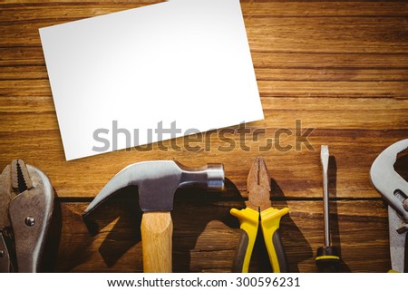 White card against desk with tools