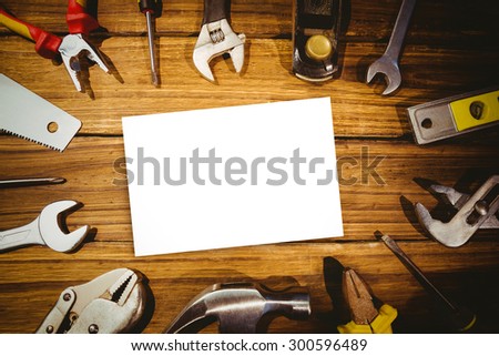 White card against tools on desk