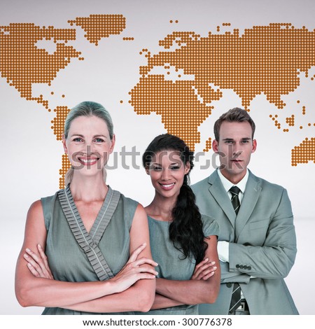 Happy business team smiling at camera against orange world map on white background