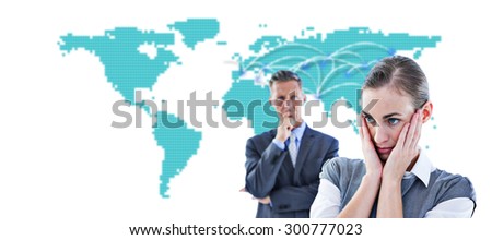 Business team thinking against world map
