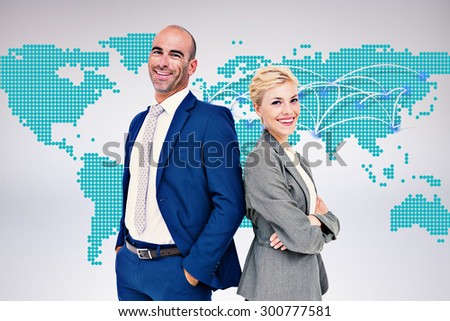 Smiling business people back-to-back against world map