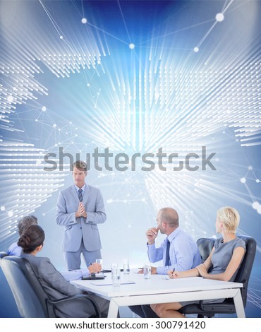 Business people listening during meeting against glowing world map on black background