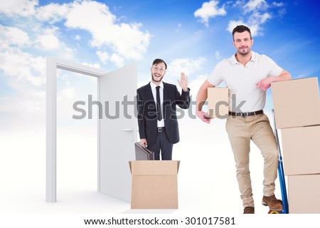 Delivery man with trolley of boxes against open door in sky