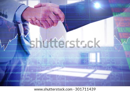 Business handshake against stocks and shares