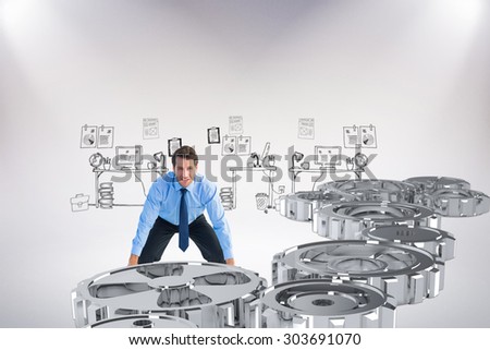 Focused businessman lifting up something heavy against doodle office