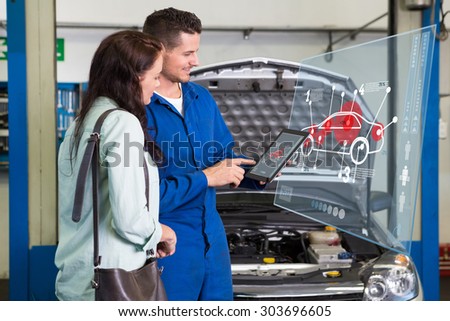 Car interface against mechanic showing customer the problem with car