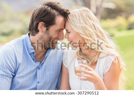 Front view of a cute couple on date giving head to head