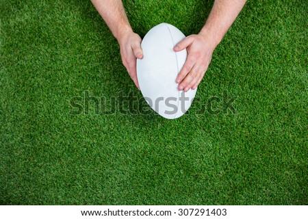 Rugby player scoring a try on astro turf grass