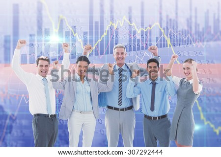Business people cheering in office against stocks and shares