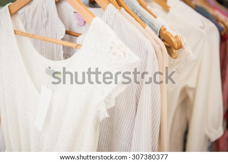 Clothes on clothes rail in clothing store
