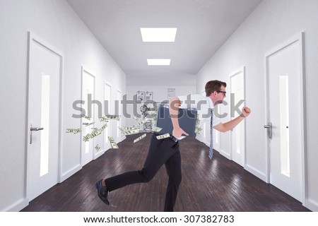 Running businessman against doodle office in hallway