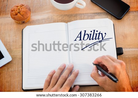 The word ability against man writing notes on diary