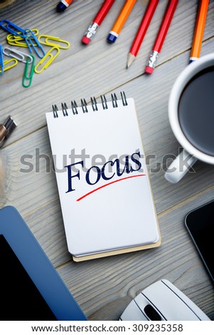 The word focus against notepad on desk