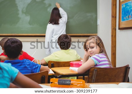 Bored student looking away from board at the elementary school