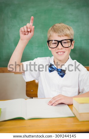 Smart student raising a hand at the elementary school