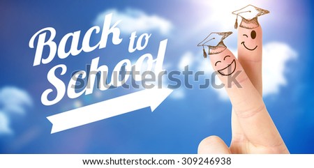 Fingers posed as students against bright blue sky with clouds