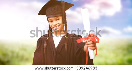 Cute pupil in graduation robe against sunny landscape