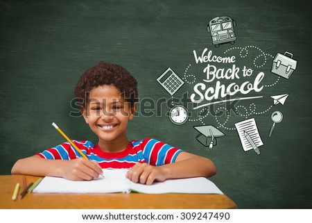Smiling pupil against green chalkboard