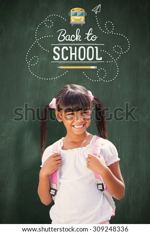 School kid against green chalkboard