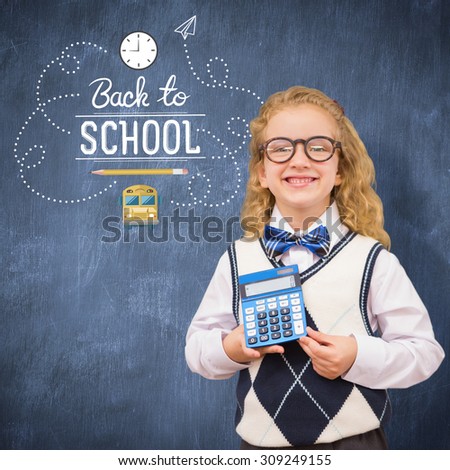 Pupil with calculator against blue chalkboard