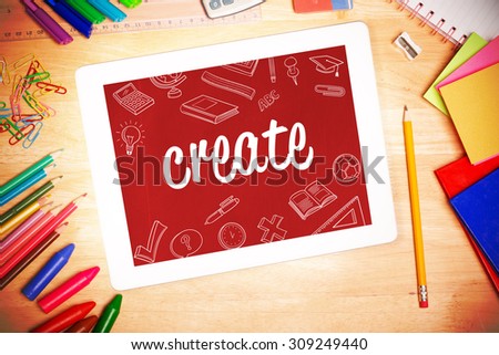 The word create and school doodles against students desk with tablet pc