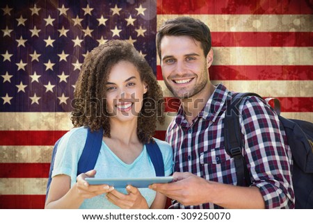 Students using tablet pc against usa flag in grunge effect