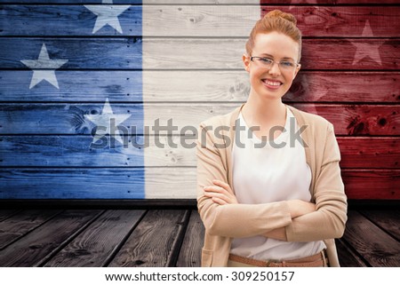 Smiling teacher against composite image of usa national flag